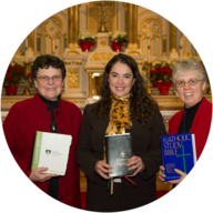 Three smiling women holding books